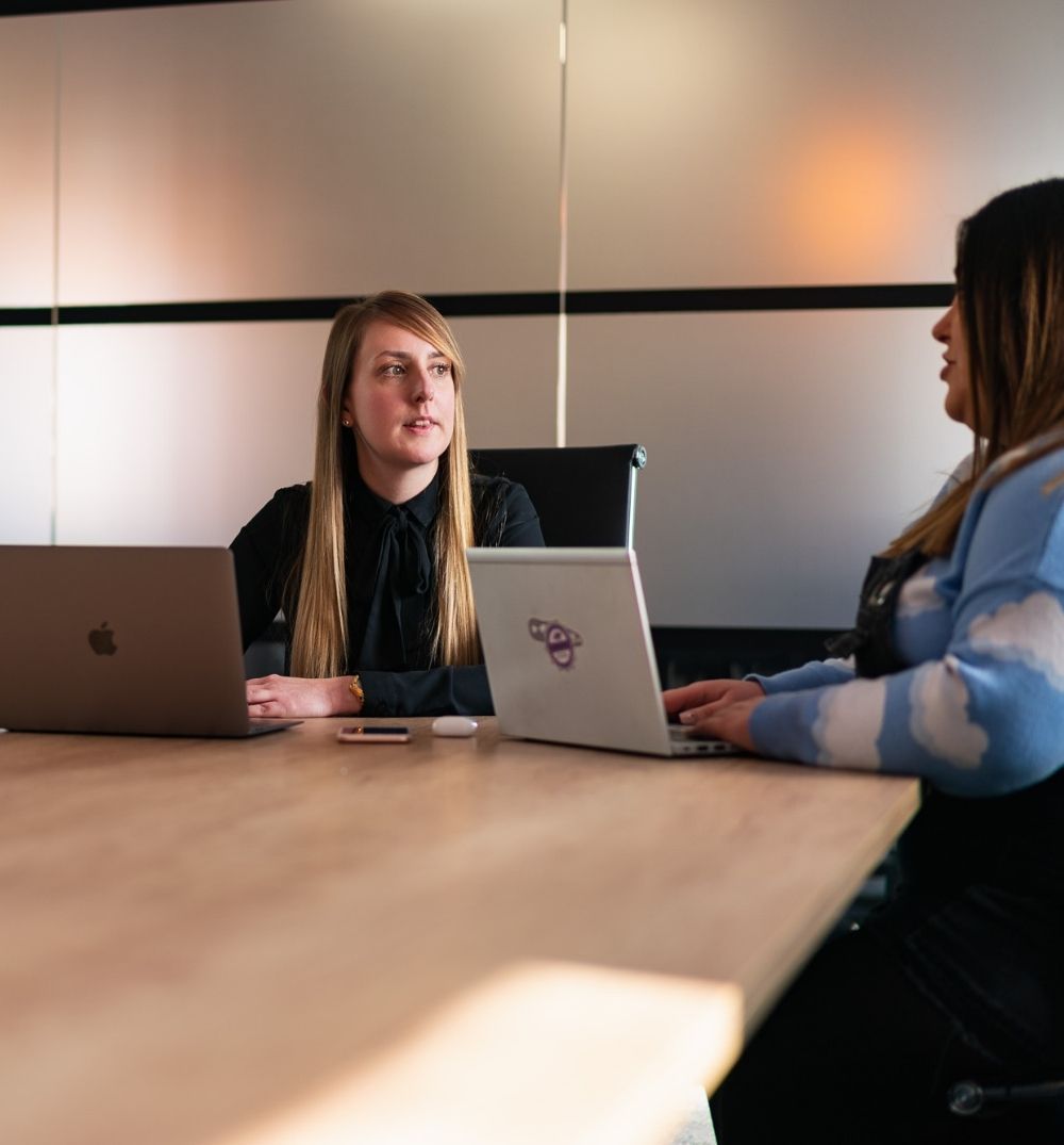 Marketing consultant planning campaigns for an automotive company during a meeting